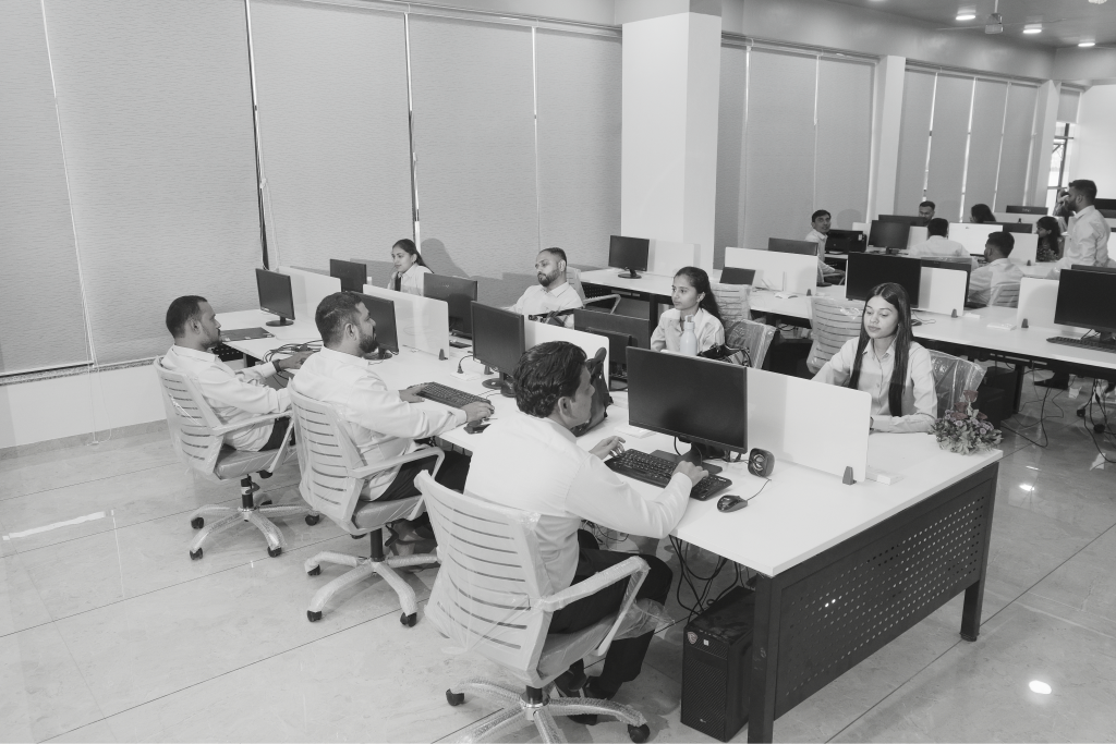 BigCloudy team collaborating at desks